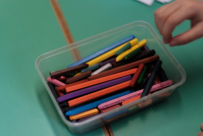 High angle view of colored pencils in pen