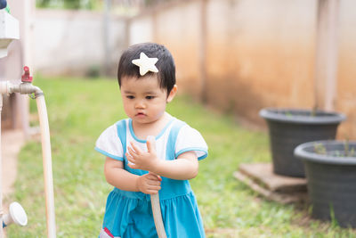 Close-up of cute girl standing in park