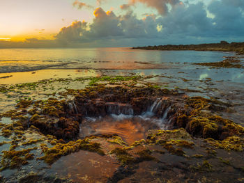 Scenic view of sea against sky during sunset