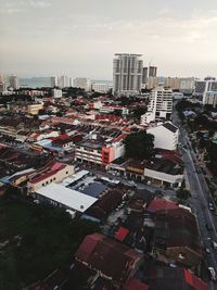 High angle view of buildings in city against sky