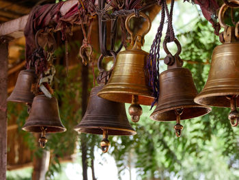 Close-up of bell hanging at market stall