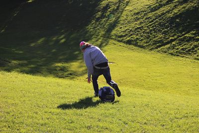 Low angle view of man riding bicycle on landscape