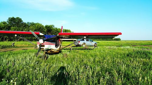 Biplane on grassy field