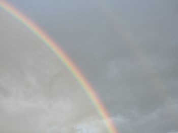 Low angle view of rainbow against sky