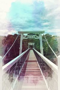 View of footbridge against sky