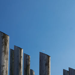 Low angle view of buildings against clear blue sky