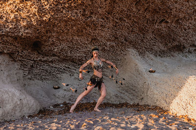 Full length of man standing on rock