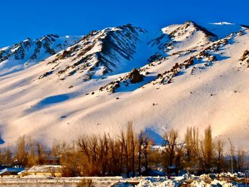 Panoramic view of snowcapped mountains against sky