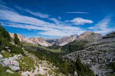 Scenic view of mountains against blue sky