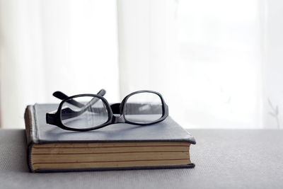 Close-up of eyeglasses on table at home