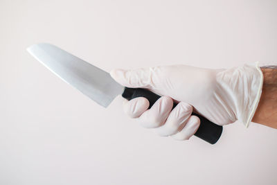 Close-up of hand against white background