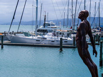 Rear view of woman looking at harbor