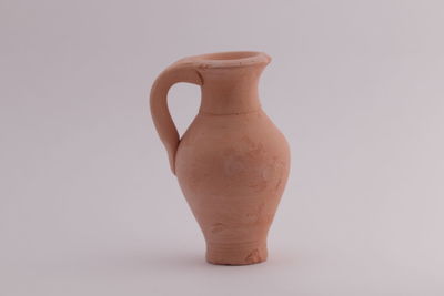 Close-up of vase against white background