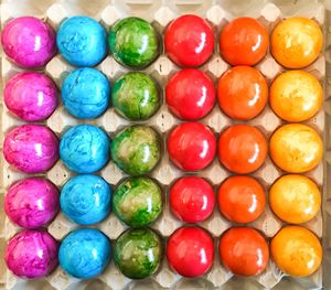 Full frame shot of colorful easter eggs arranged in carton