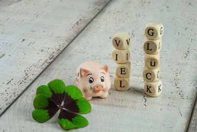 Close-up of toy with leaves on table