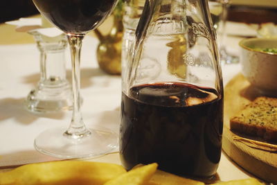 Close-up of red wine in glass on table