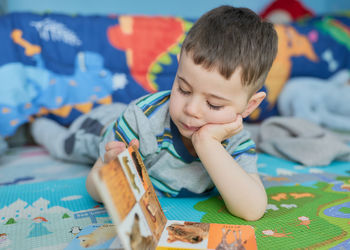 Close-up of boy drawing on table