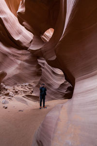 Man standing in antelope canyon