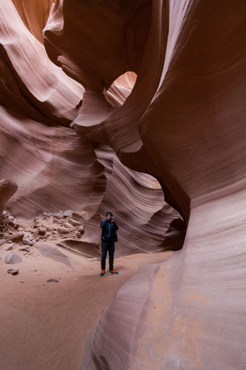 Man standing in antelope canyon