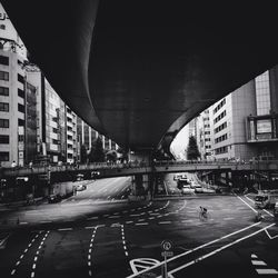 Bridge in city against sky