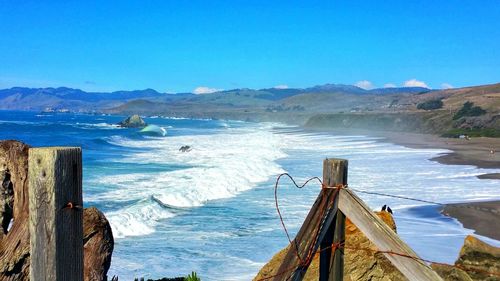 Scenic view of sea against blue sky