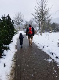 People walking on snow during winter