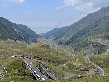 High angle view of road amidst mountains against sky