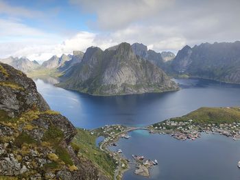 Scenic view of lake and mountains against sky