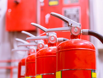 Close-up of red fire extinguishers