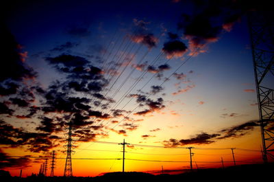 Low angle view of silhouette trees against sky at sunset