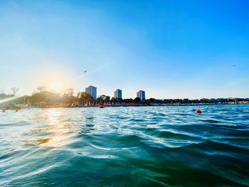 Scenic view of sea against blue sky