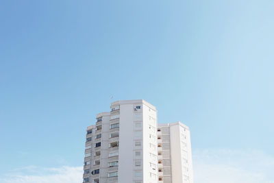 Low angle view of building against clear blue sky