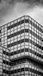 Low angle view of ibm nederland building by lucas and niemeijer against sky