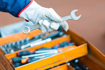 Close-up of mechanic holding wrench