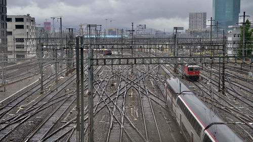 High angle view of train in city against sky