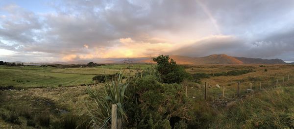 Scenic view of land against sky during sunset