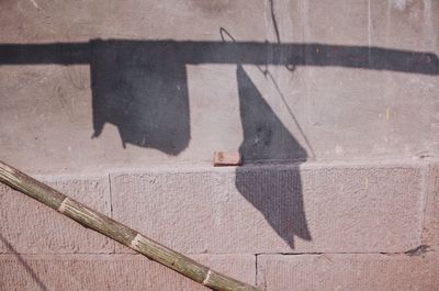 High angle view of shadow on wall