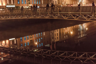 Bridge in city at night