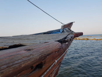 View of boat on sea against clear sky