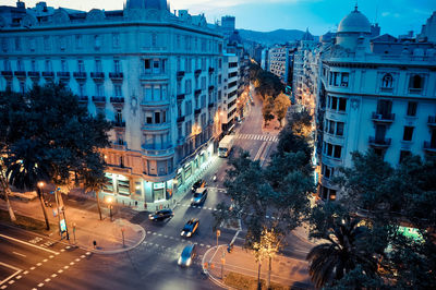 High angle view of traffic on road amidst buildings in city