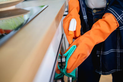 Midsection of man working in factory