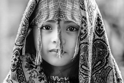 Close-up portrait of girl wearing headscarf