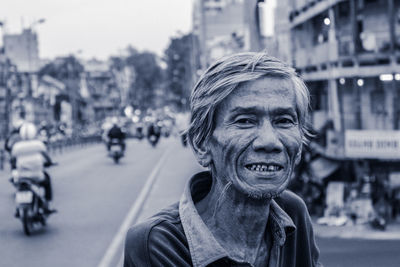 Portrait of smiling man on street in city