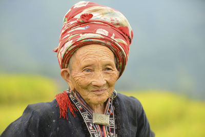 Portrait of smiling man against blurred background