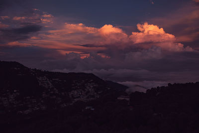 Scenic view of dramatic sky at sunset