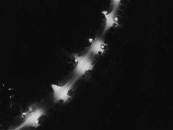 Illuminated cars on road at night