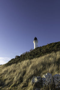 Low angle view of lighthouse against clear sky