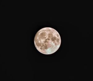 Low angle view of moon against sky at night