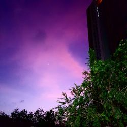 Low angle view of building against sky during sunset