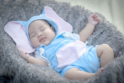 Portrait of cute girl sleeping on bed